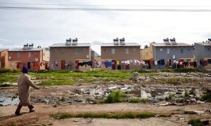 Cape Town South Africa - Washing hangs behind a newly developed RDP housing project in Langa where all houses are equipped with solar heaters.